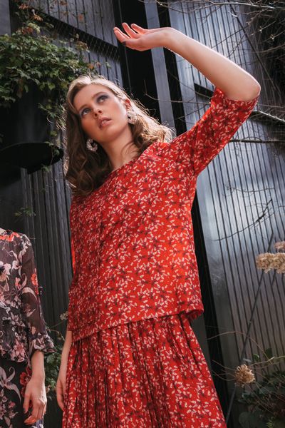 									OVER + OUT TOP
								, 			HOT PLEAT SKIRT
			