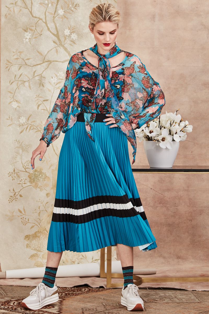 									BY AND TIE SHIRT
								, 			BEAT THE PLEAT SKIRT
			