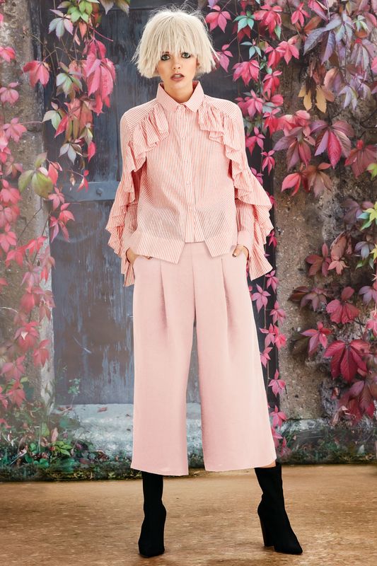 									IN A RUFFLE SHIRT
								, 			SMOOTH SAILING PANT
			